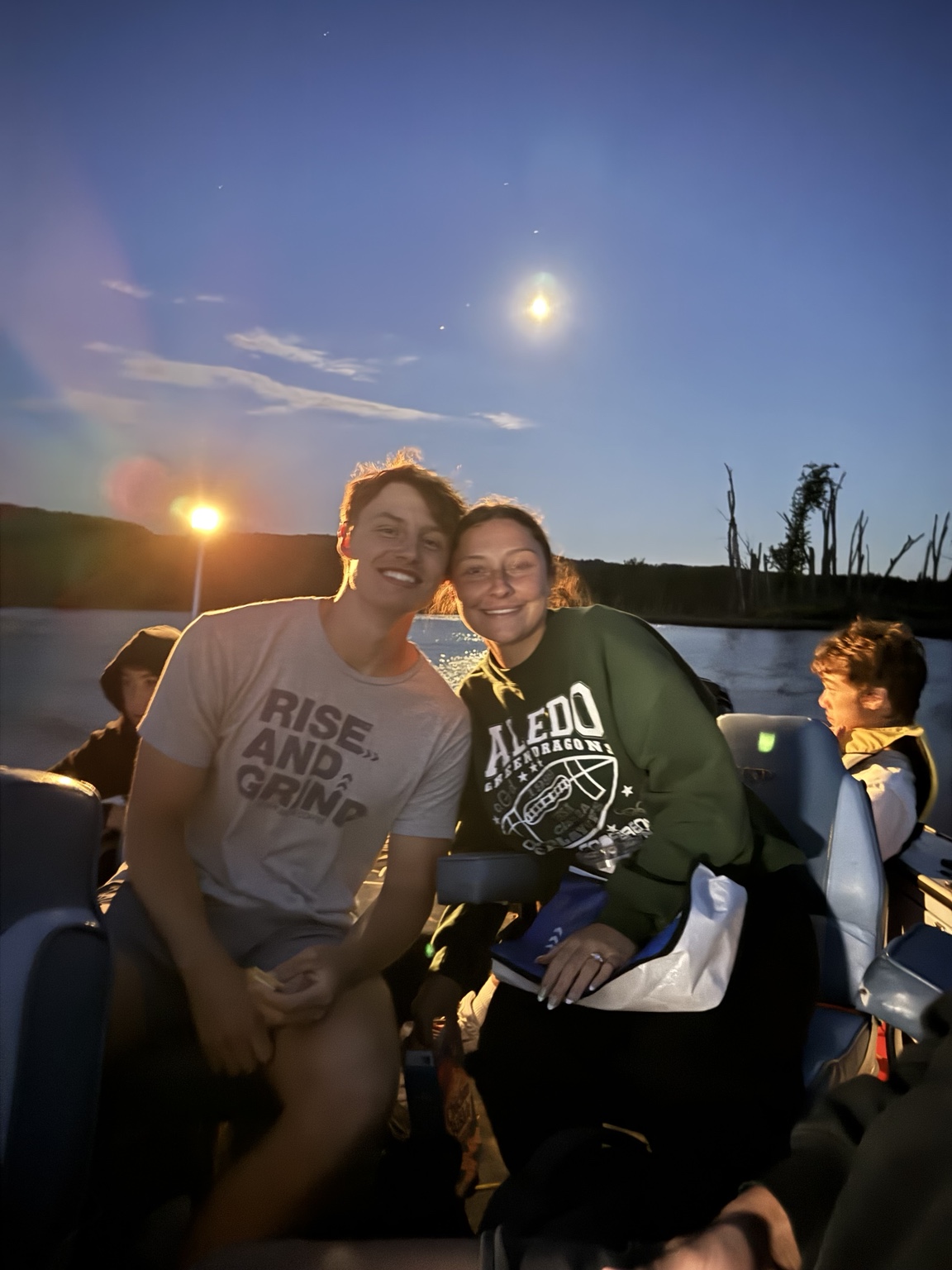 Original evening boat photo of family and friends